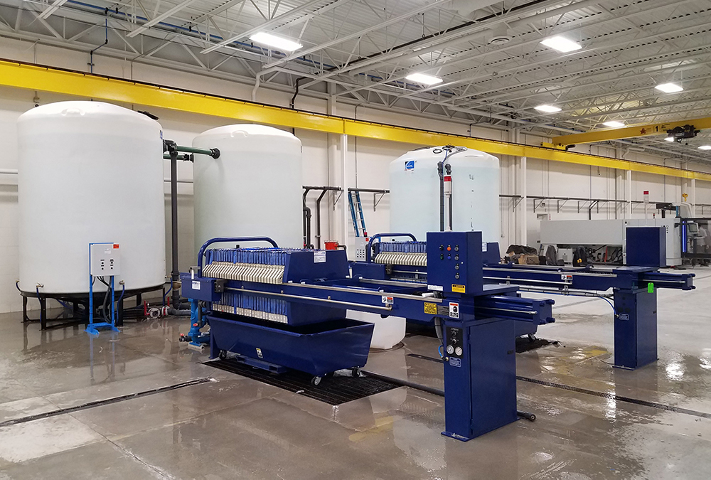 WATER TREATMENT PRESS SYSTEM