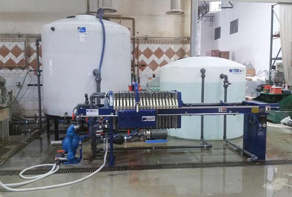 WATER TREATMENT PRESS SYSTEM