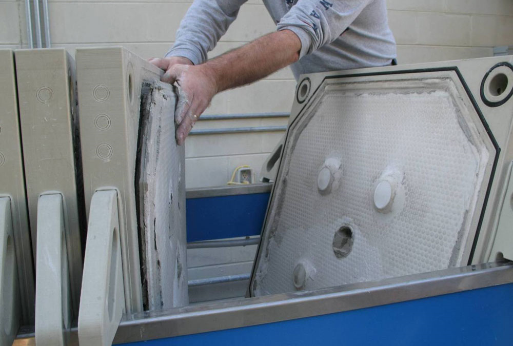 WATER TREATMENT PRESS SYSTEM