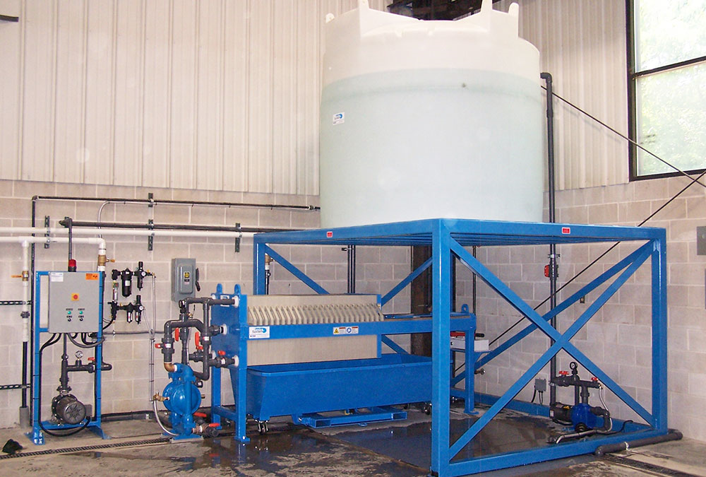 WATER TREATMENT PRESS SYSTEM