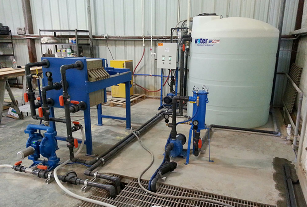 WATER TREATMENT PRESS SYSTEM